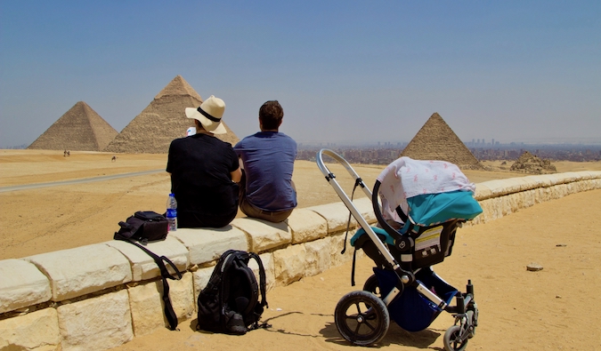 Brook Silva-Braga in Egypt with his family, sitting near the pyramids