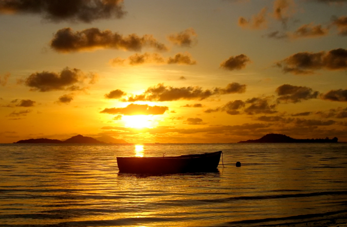 Stunning boat silhouette at sunset in the Seychelles