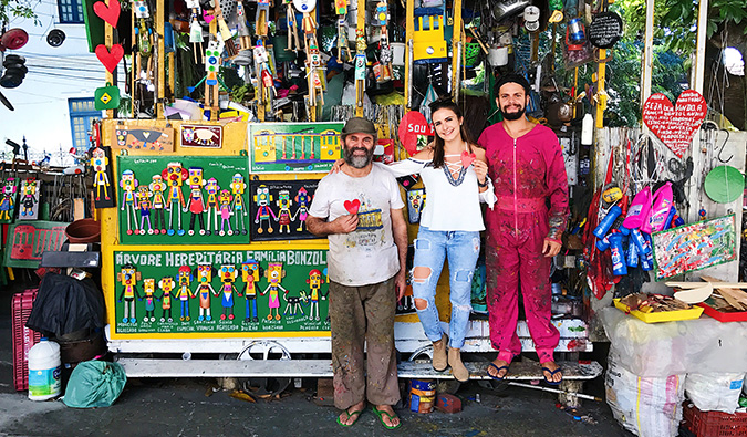 Celinne da Costa posing with some locals