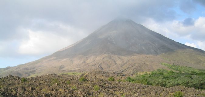 arenal volcano surrounded by jungle in costa rica