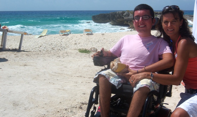 Cory Lee posing for a photo on the beach