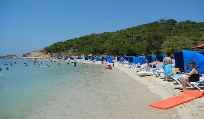 Packed beaches filled with people from the cruiseship