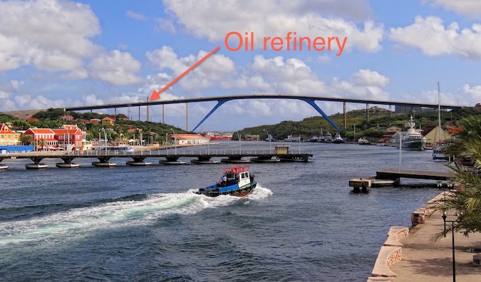 Willemstad's waterfront with an arrow pointing to the oil refinery in the Caribbean