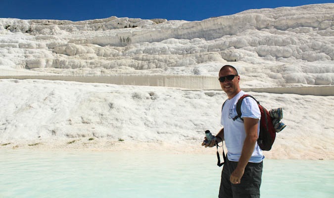 Dave dean smiling with his technology and camera while traveling