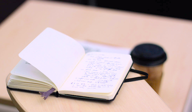 an ope notebook on a desk, photo by @waferboard (flickr)