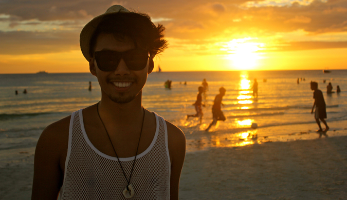 DJ from Dream Euro Trip at sunset on a beach, living his dream