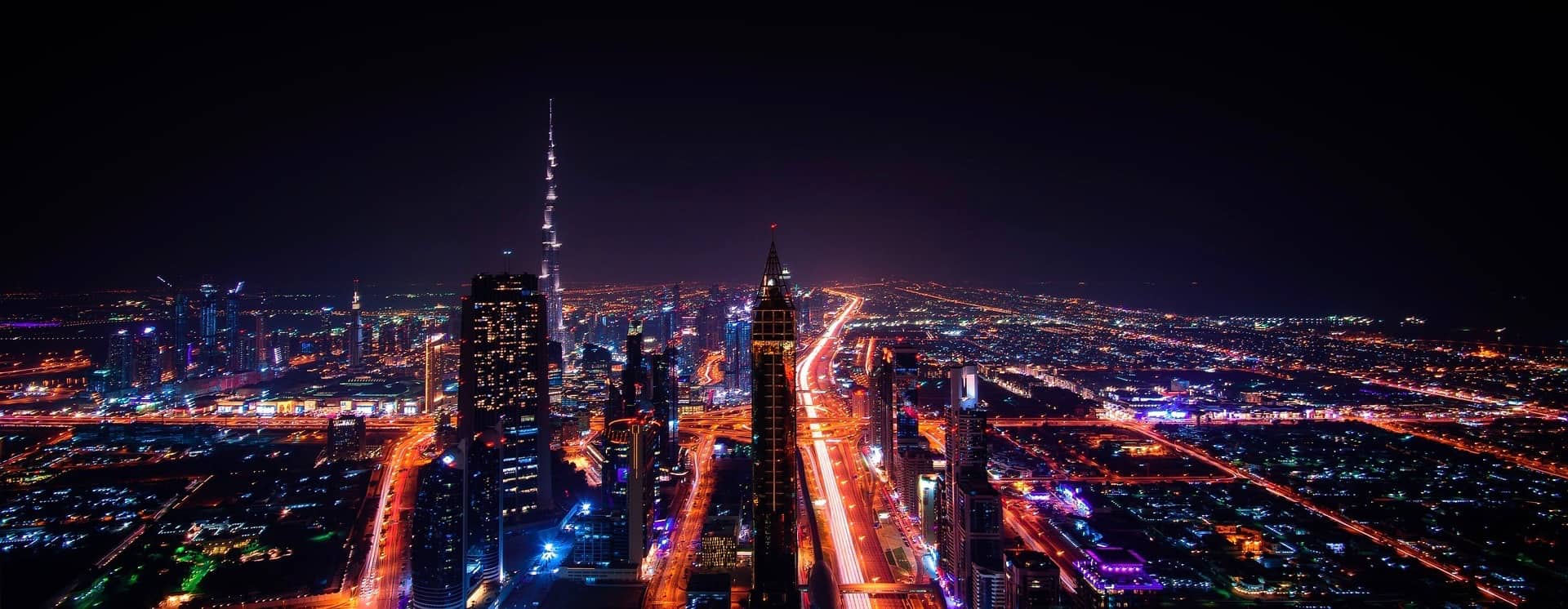 The towering and iconic Dubai skyline lit up at night