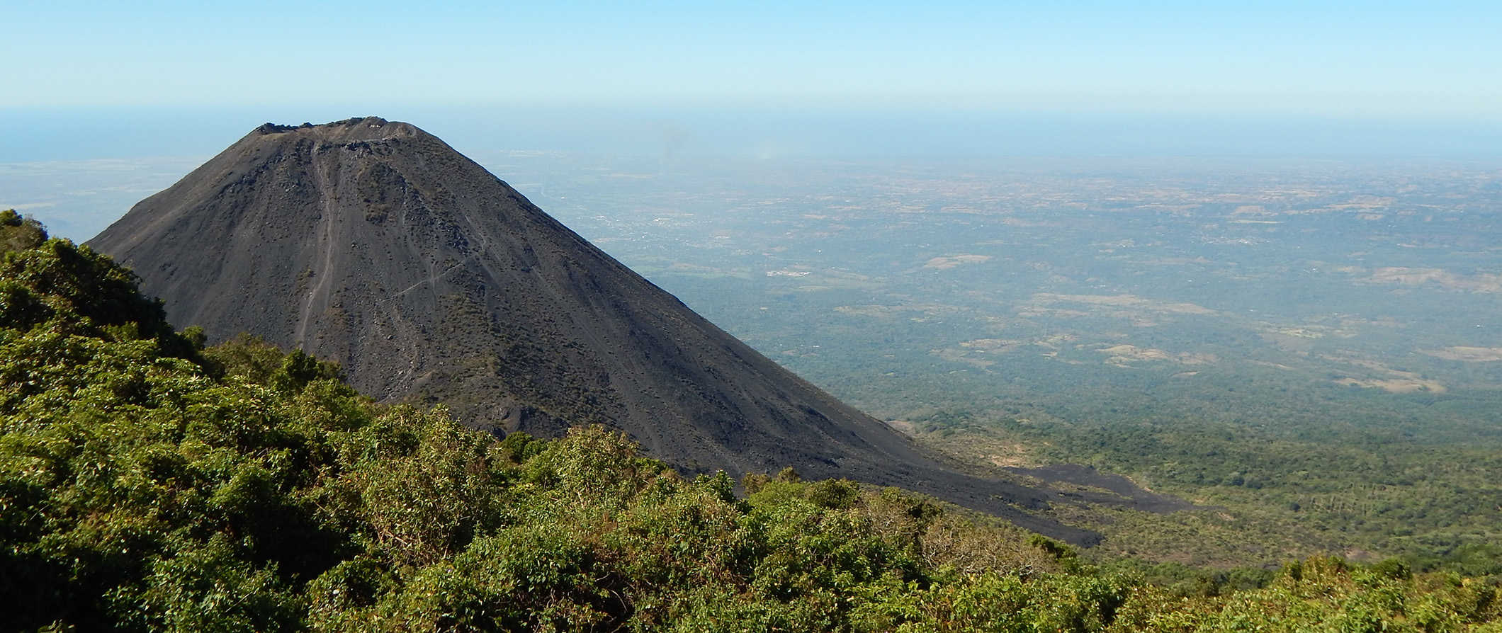 a volcano in El Salvador surrounded by a sprawling, lush jungle