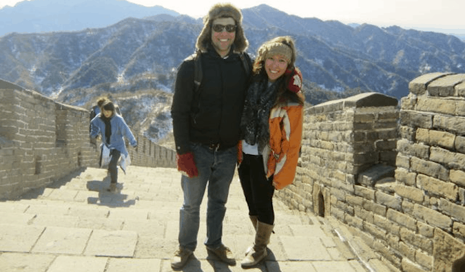 Two travelers posing together on the Great Wall in China