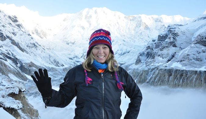 Erin from goeringo trekking in Nepal through snow-covered mountains