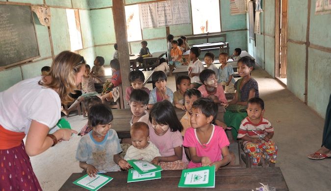 Erin from goeringo in burma teaching children in a small classroom