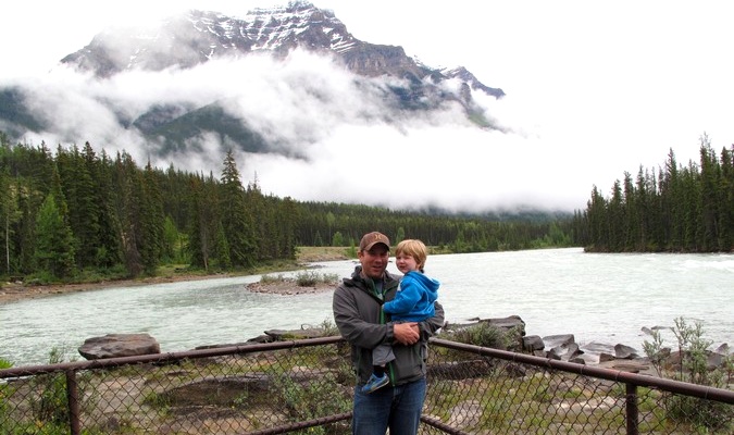 dad and toddler smiling on an international family vacation