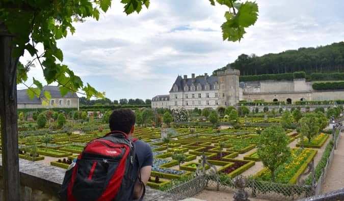 Nomadic Matt posing at the Villandry chateau in France during the summer