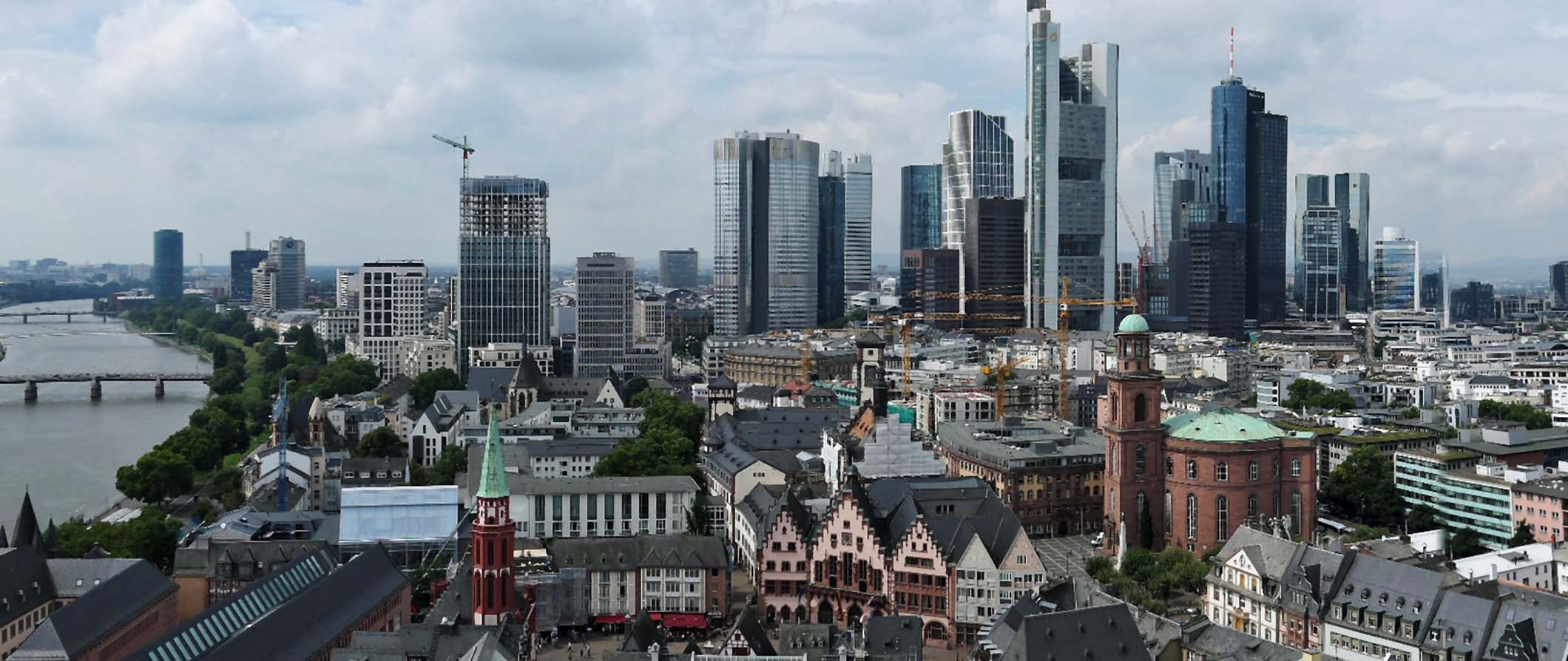 An aerial view of downtown Frankfurt, Germany featuring numerous skyscrapers