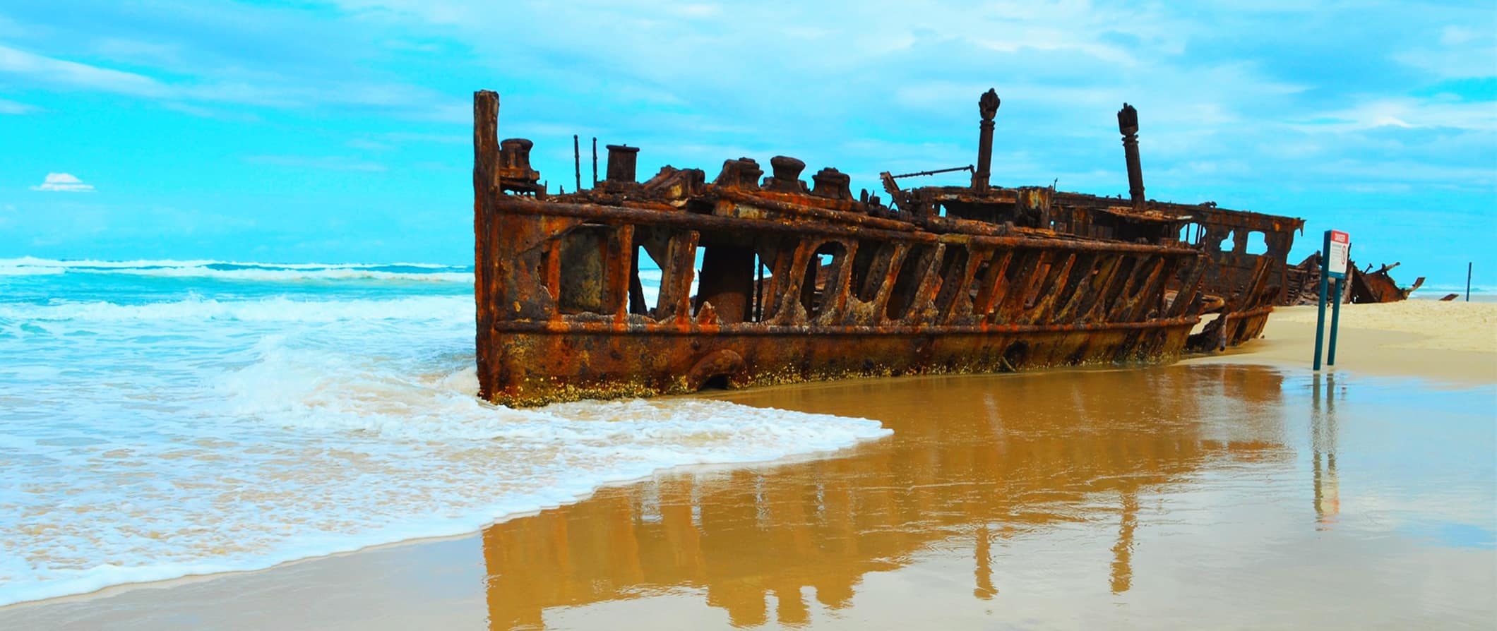 A famous rusted out 20th century shipwreck on the beach of Fraser Island in Australia