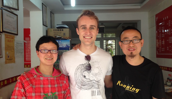 Scott with his homestay family in China, posing for a photo