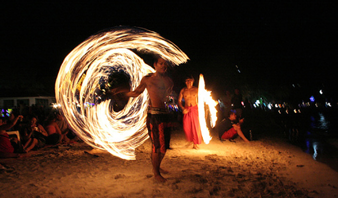 A move dancer on Haat Rin beach inwards thailand The Ultimate Guide to the Full Luna Party