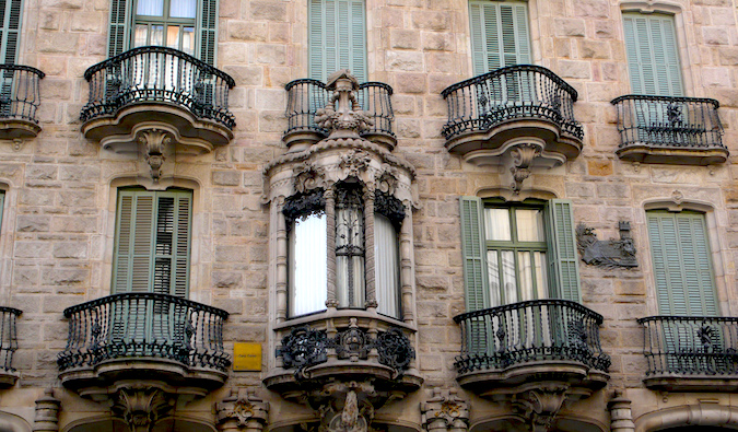 The windows and small balconies of Gaudi's Casa Calvet in Barcelona, Spain