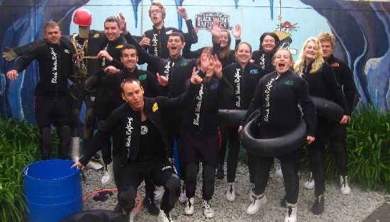 12 wet-suit wearing people executed to see glow worms