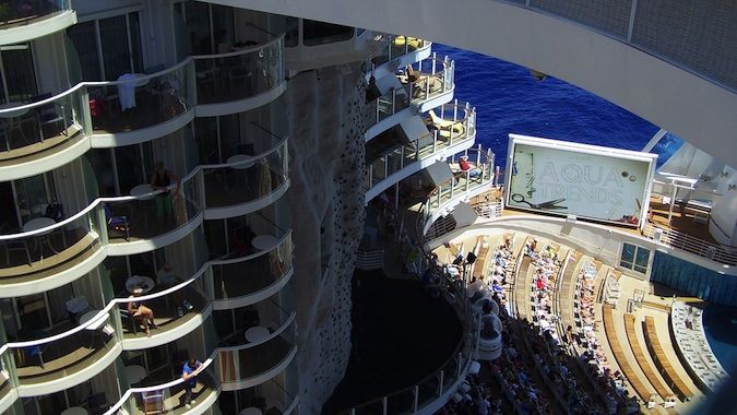 The side of a cruise ship, showing the levels of rooms and the deck