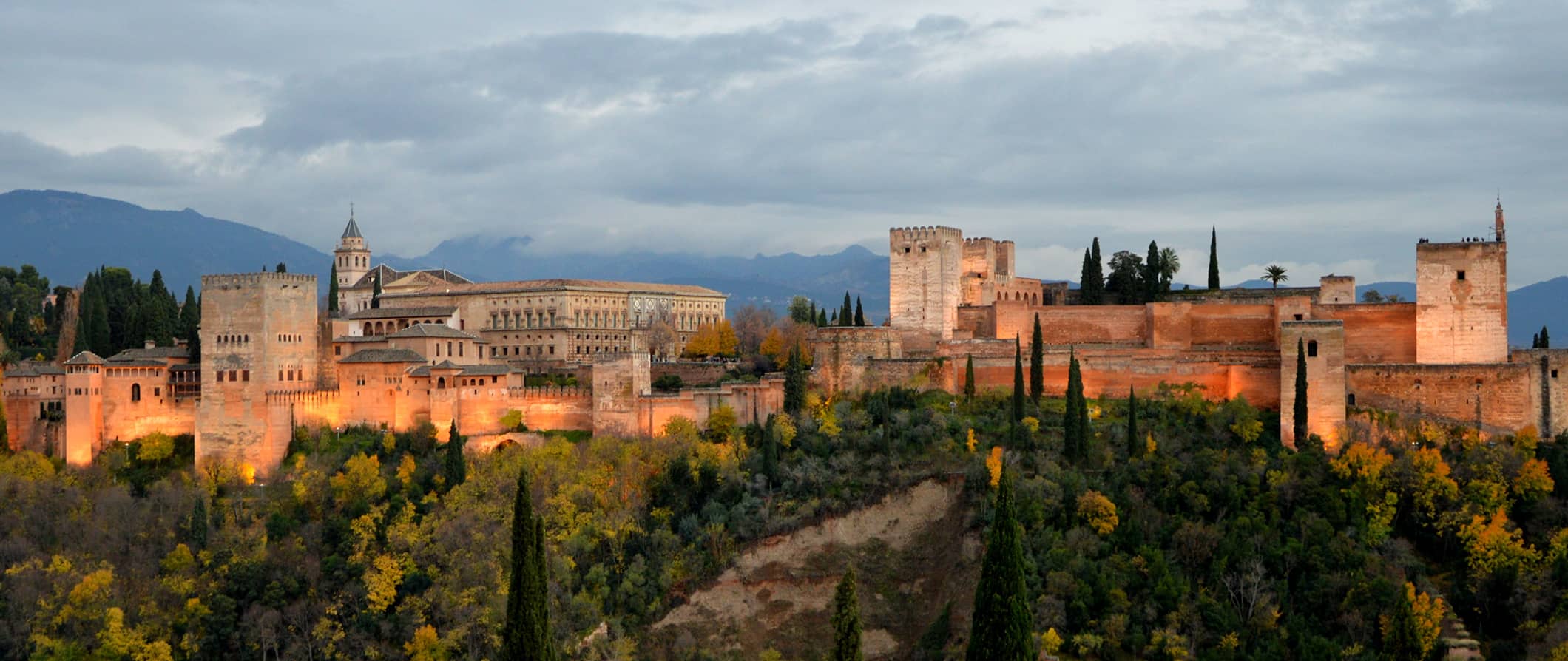 The famous and historic Alhambra Palace in Granada, Spain surrounded by greenery