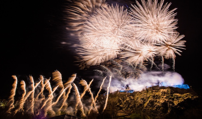 Bursts of fireworks fill the Scottish sky during Hogmanay in Edinburgh