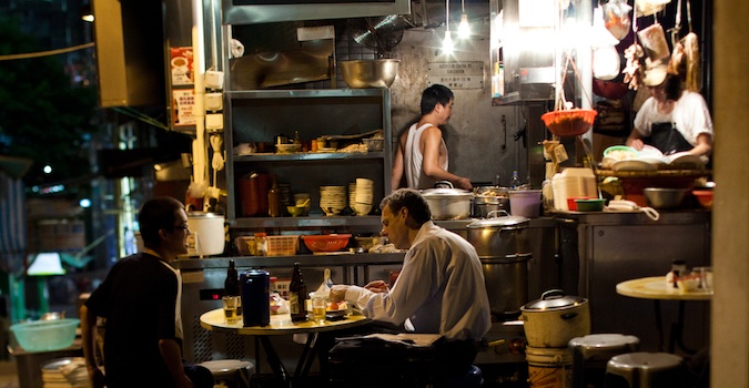 cooking food at a street stall in Hong Kong