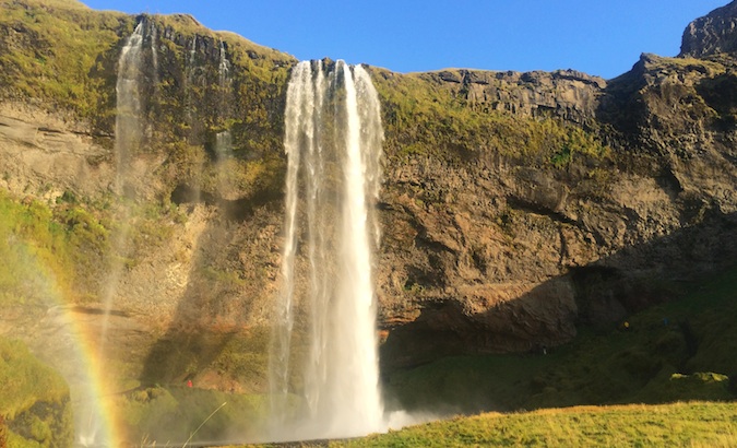 Front side of Seljalandsfoss with a Icelandic rainbow