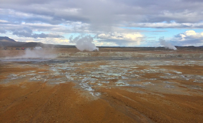 sulfur pool called Hverir with blue water and red earth