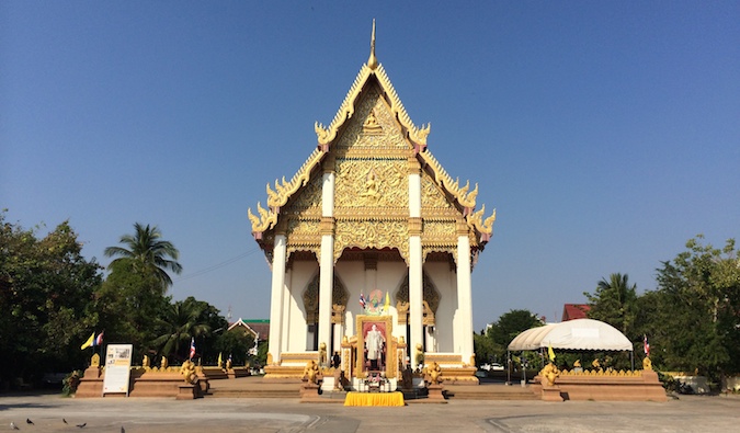 Golden-roofed temple in Isaan, Thailand on a sunny day