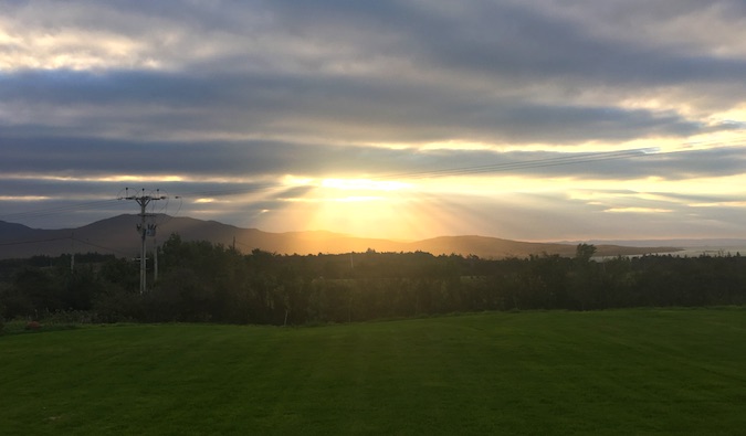 beautiful sun streaking through clouds in islay