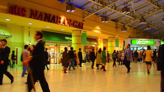 A busy train station full of people in Japan