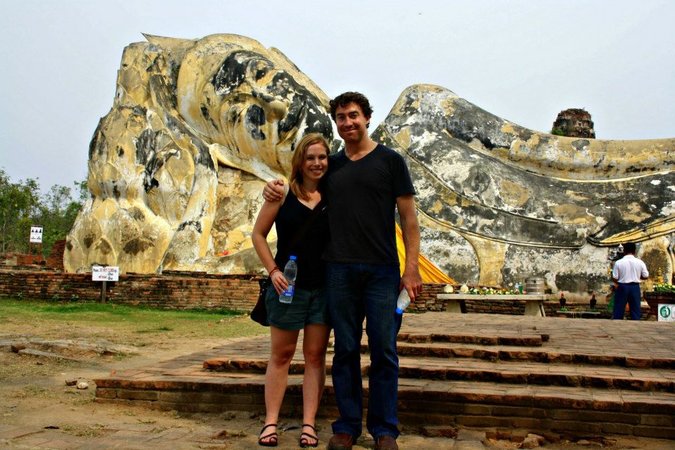 Two travelers posing for a photo together in Asia