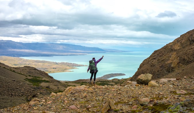 backpacker in front of an incredible lake view