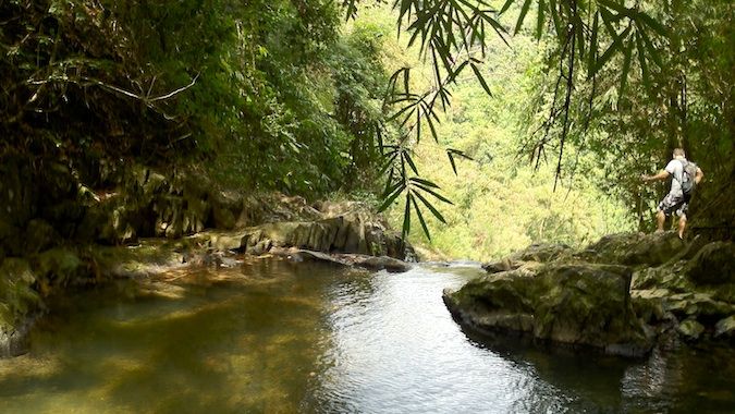 Looking out over a waterfall in Khao Sok