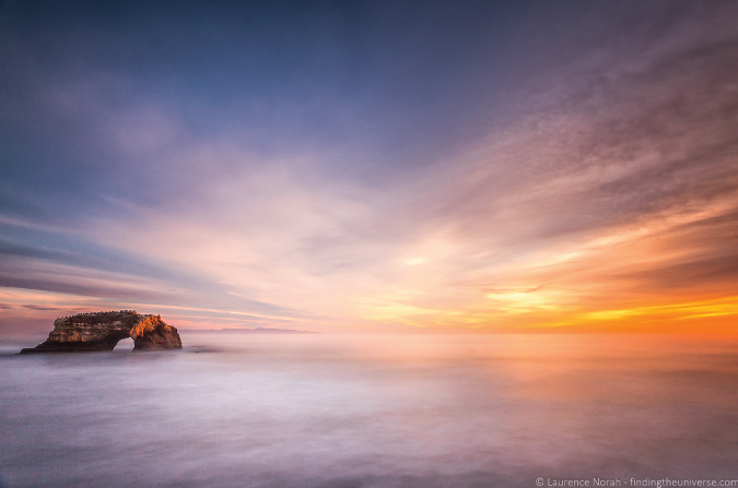 Photo of a beautiful, golden sunset over the ocean in Santa Cruz, California