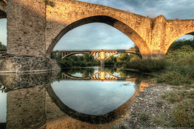 Photo of old bridges in the Medieval town of Besalú, Spain