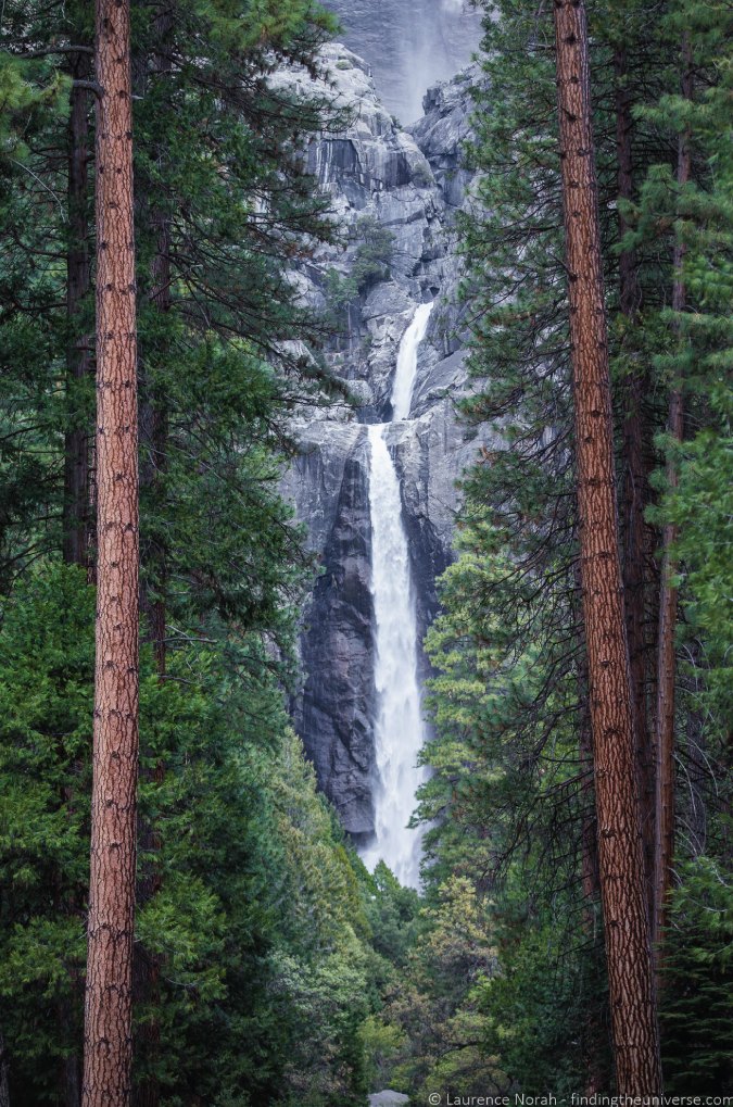 Photo of Lower Yosemite Falls between the trees in Yosemite National Park