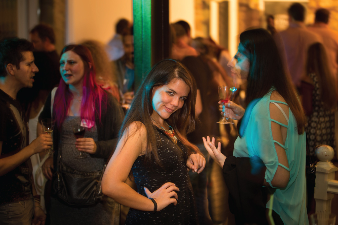 Photo of a woman having at a party with friends