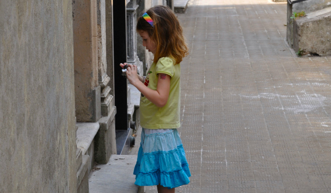 The Future is Red Family daughter walking on a wall overseas