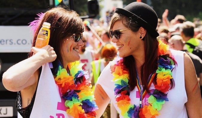 Lesbians at Pride covering in paint and flags