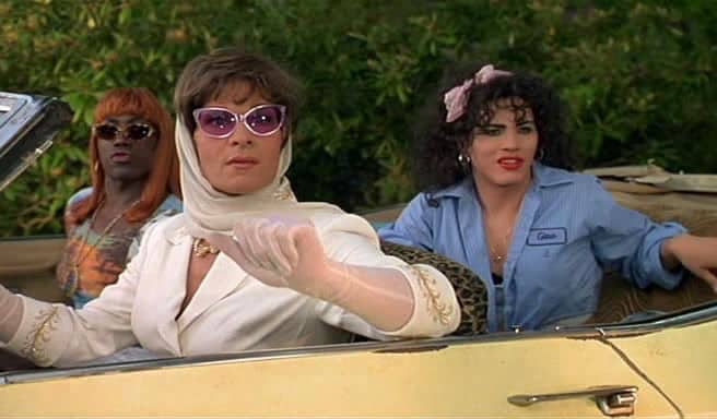 Men dressed in drag sitting in a car