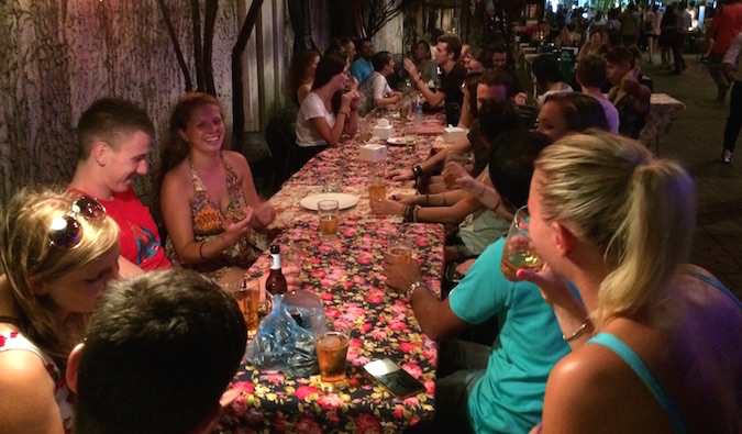 Travelers hanging out and eating in Bangkok