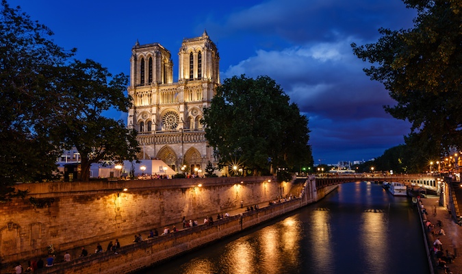 church in paris that is so stunning in the night backdrop