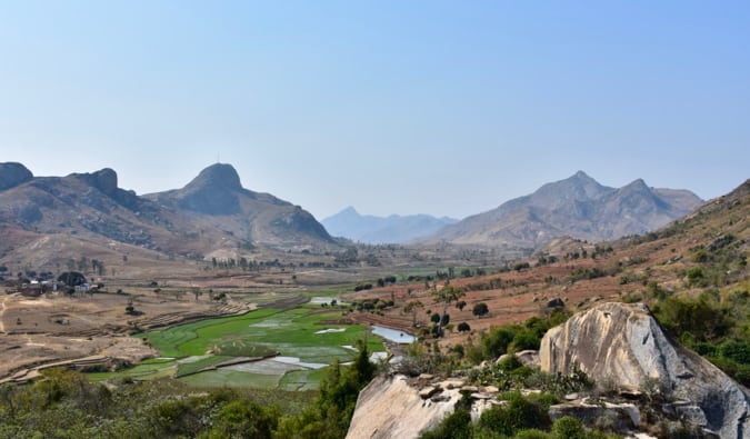 An empty valley with brown hills in the distance in Madagascar