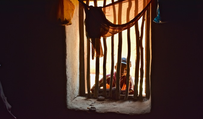 A boy looking through a window