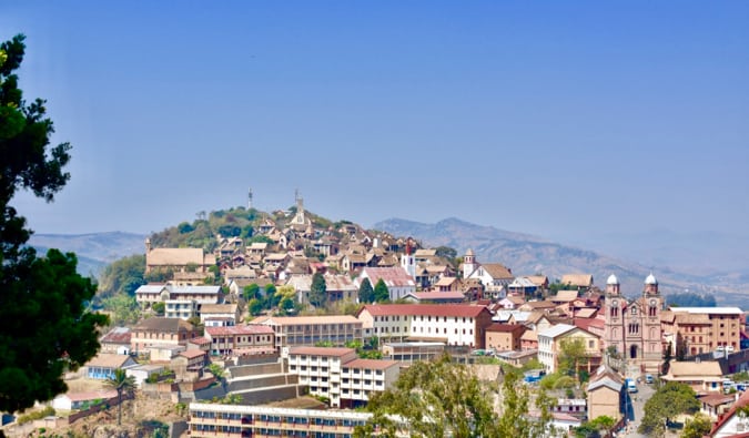 A city surrounded by dry hills and thing forests in Madagascar