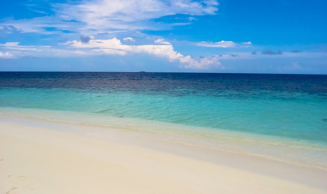 The beach and shoreline on a sunny day in The Maldives