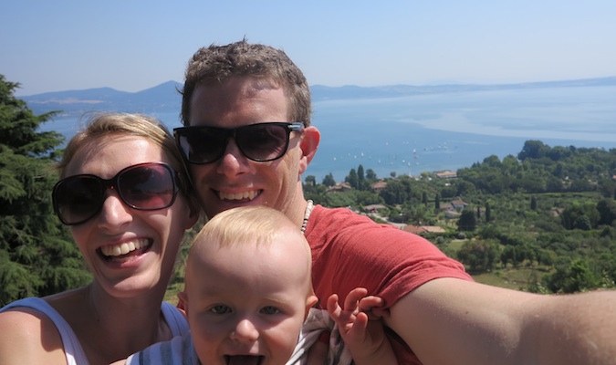 family smiling together on a trip traveling overseas