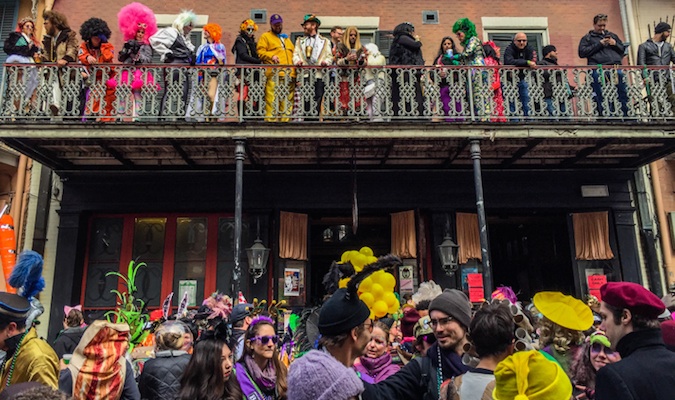 Onlookers watching the parade at Mardi Gras